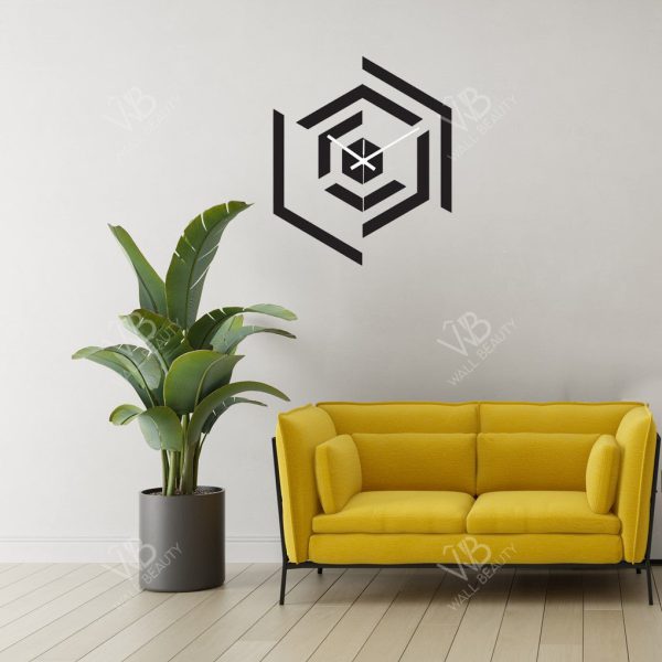 a yellow couch sitting in a living room next to a plant
